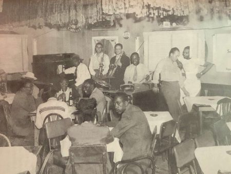 Fats Domino seated at the piano in the Hideaway, the no-frills bar in the Ninth Ward where he was discovered in 1949. Courtesy of Rick Coleman via Frank Oxley. Photo restored by Jason Kruppa.