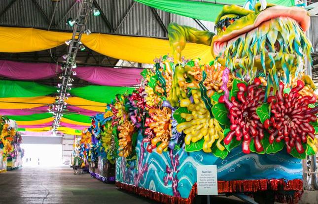 Large, colorful parade floats inside Mardi Gras World
