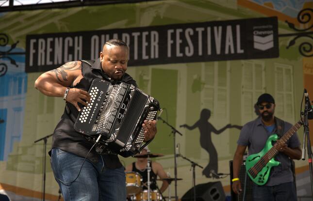 A musician plays the accordion at the French Quarter Festival in New Orleans.