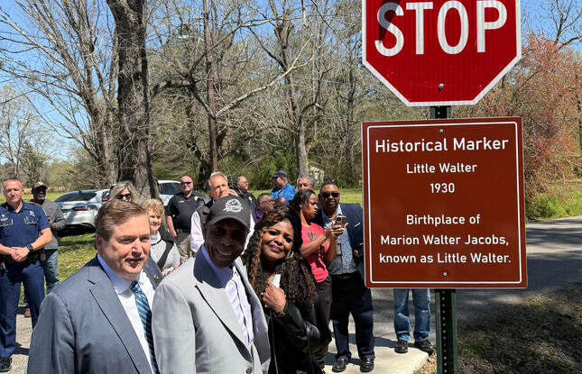 Lieutenant Governor Billy Nungesser and legendary Louisiana blues guitarist Buddy Guy stand next to a historical marker noting the birthplace of Little Walter.