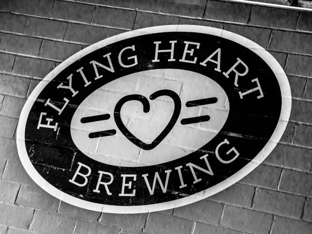 Flying Heart logo on brewery wall.