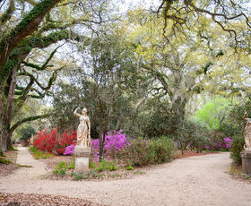 A wide-lens photo of the gardens at Rosedown State Historic Site.