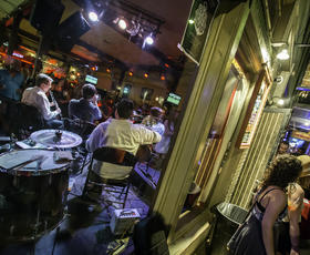 Picture conveying the sounds and energy of Frenchmen Street in New Orleans.