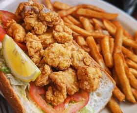 A fried oyster po'boy sandwich.