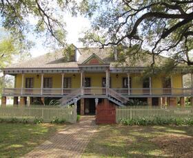 Outside of Vacherie, Louisiana, a stately, buttercup-yellow mansion stands on the grounds of the Laura Plantation.