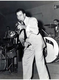 COURTESY OF THE NEW ORLEANS JAZZ MUSEUM. Photo of the Louis Prima Band, the first band with Irving Fazola, from left to right: Louis Prima, Ewell Lamar, (?), Irving Fazola, Johnny Viviano, (?).