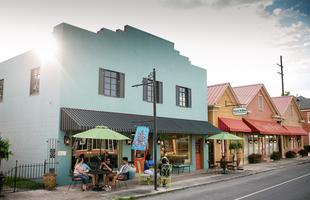 Colorful buildings line a Louisiana main street.