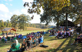Guests gather in lawn chairs in the hills of northern Louisiana to enjoy a concert at Landry Vineyards.