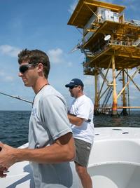 Girl catching a fish on Fishing Charter in Venice